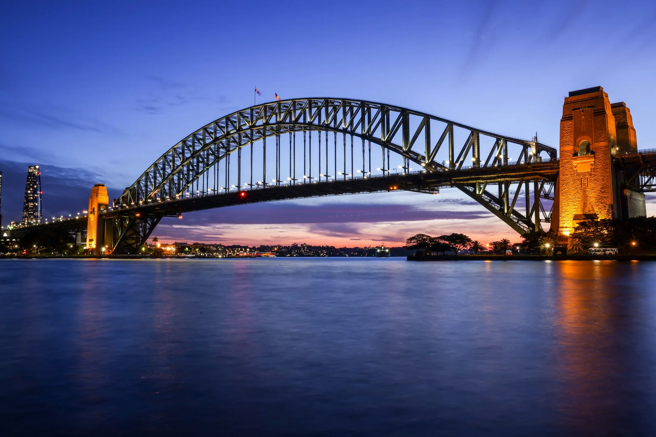 Sydney Harbour Bridge illuminated at dusk